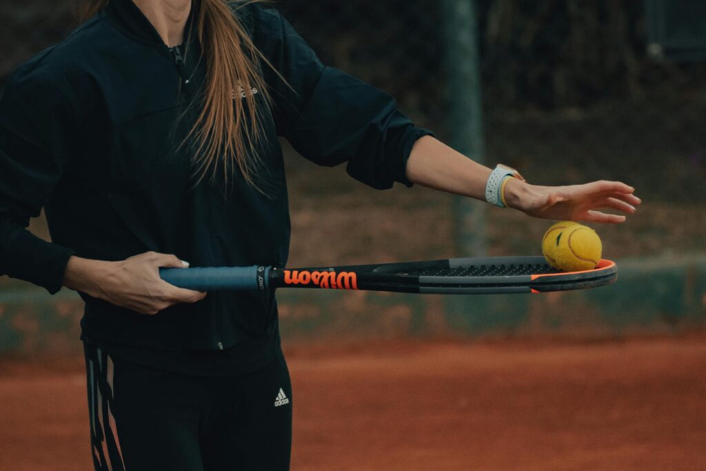 Woman Beginner Tennis Player Testing a New Racket