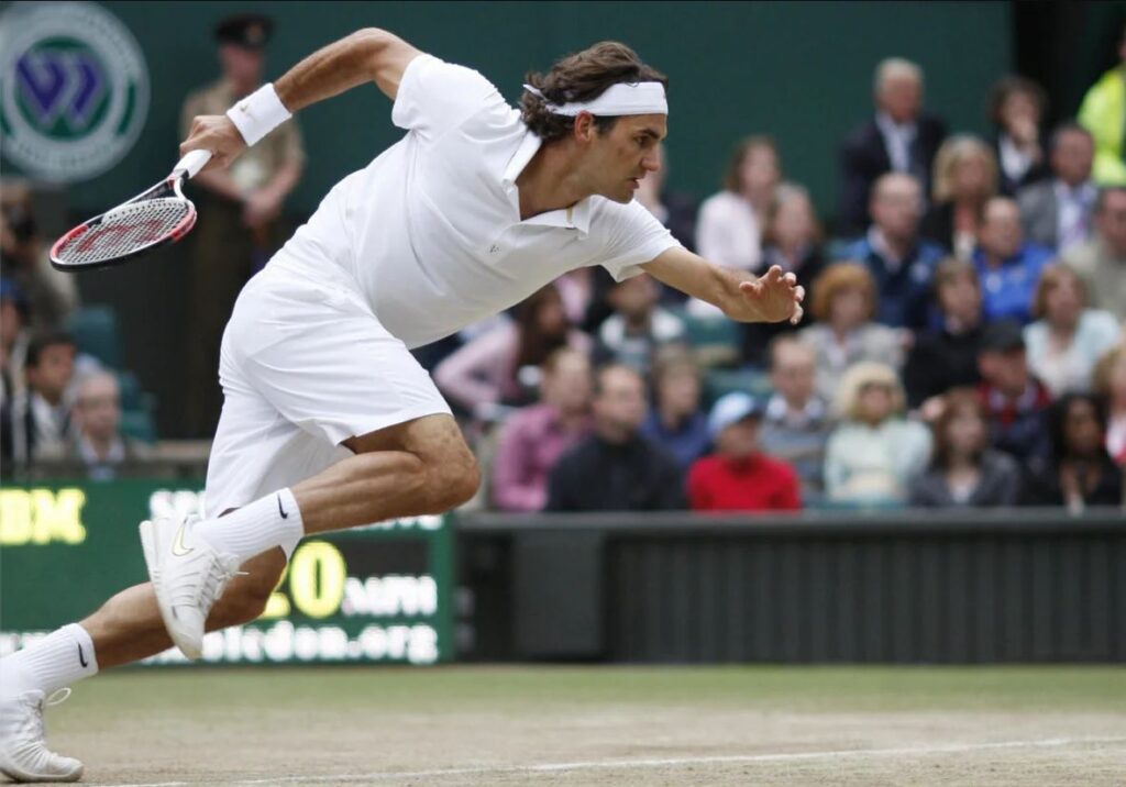 Roger Federer displaying exceptional speed and agility on the tennis court.
