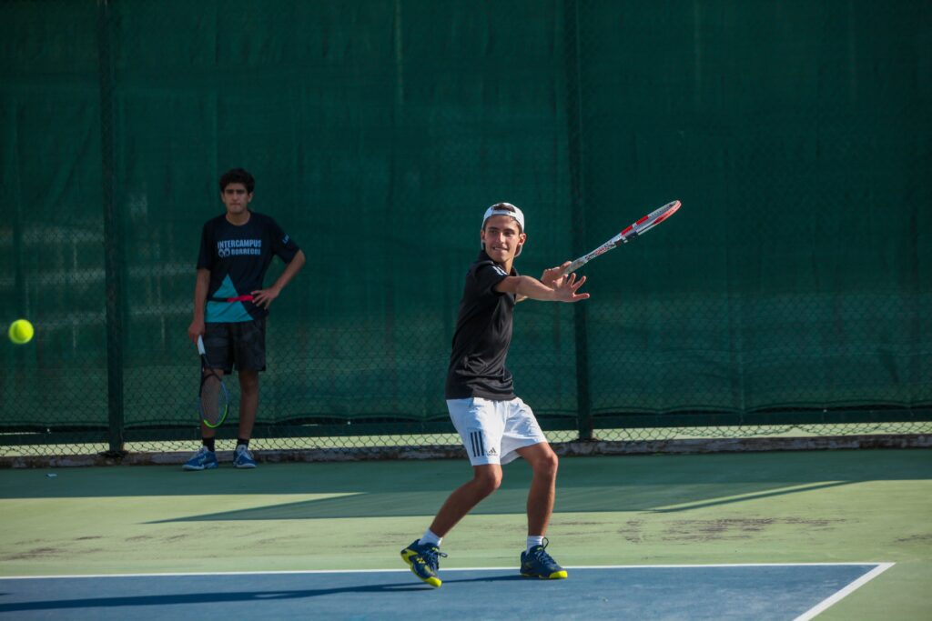 Boy Preparing to hit a forehand during a tennis rally