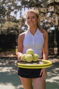 Female tennis player happy to be on the court