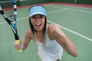 Tennis player celebrating a win, symbolizing power and speed.